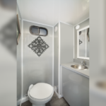 image shows the interior of a "Selfie Slim 2 Station Restroom Trailer".